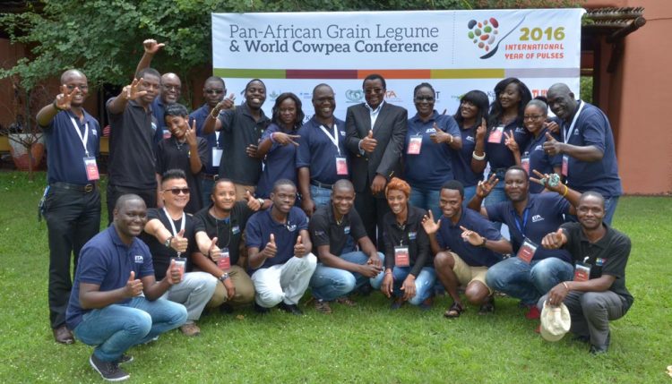 Picture of The “black and blue” conference crew with Dr Chikoye with an all thumbs-up for a successful conference at the close of the event on 4 March.