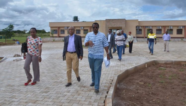 Picture of David Chikoye (right) briefing Chiji Ojukwu (AfDB) as they walk around the SARAH campus.