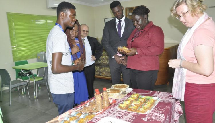 Picture of The Tony Elumelu Foundation delegation and IITA Management team interact with an IITA Youth Agripreneur