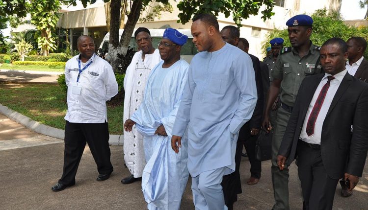 Picture of IITA DG Nteranya Sanginga (left) and former Nigerian President Olasegun Obasanjo (wearing blue headdress) with some government officials and partners.
