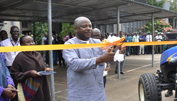 Picture of DG Sanginga cutting the tape to launch the equipment