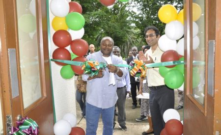 Picture of DG Sanginga cutting the ribbon during the commissioning of the BASICS office, in IITA,Ibadan, with BASICS project coordinator Hemant Nitturkar.