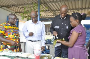 Picture of From (Left - Right ) Mr Sidibé and Dr Touré at the Cassava processing unit.