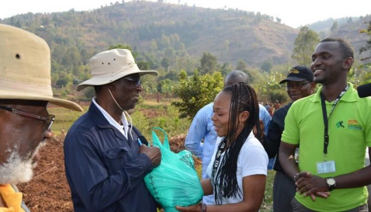 Picture of IKYA members giving some agroprocessing products to (L-R) the South-Kivu Governor HE Marcelin Chishambo Ruhoya and General Secretary Adolphe Mulumba.