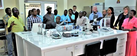 Picture of IITA delegation being shown the state-of-the-art Mycotoxin Lab by Boahen.