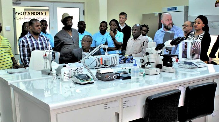Picture of IITA delegation being shown the state-of-the-art Mycotoxin Lab by Boahen.