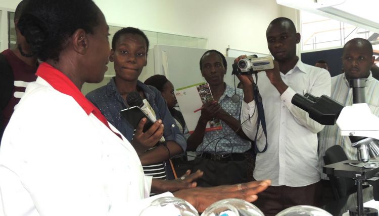 Picture of media interacting with staff at the Eastern Africa hub.