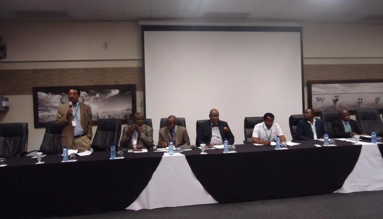 Picture of IITA Maize Breeder Abebe Menkir with other members of the high table.