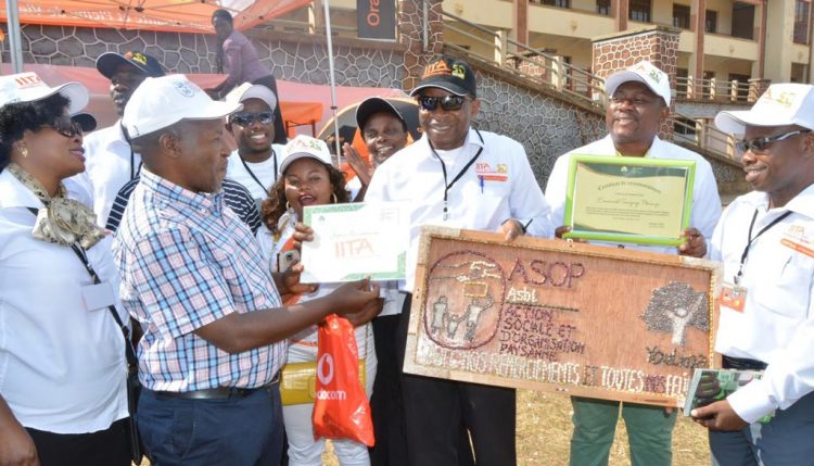 Picture of Chris Okafor, OiC, IITA in Kalambo accepting an award on behalf of IITA at the ceremony.