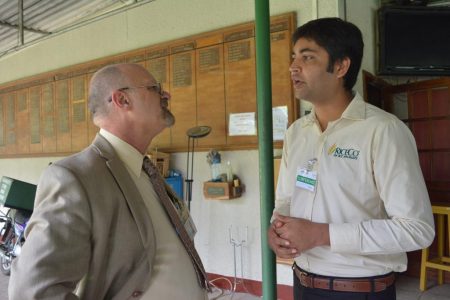 Picture of Dr Ken Dashiell (left) speaking to Shanni Srivastava of UPL, an agrochemical company.