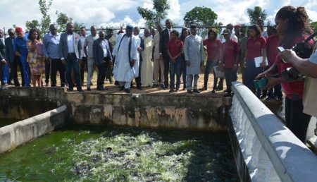 Picture of agripreneurs showing off the fish ponds.