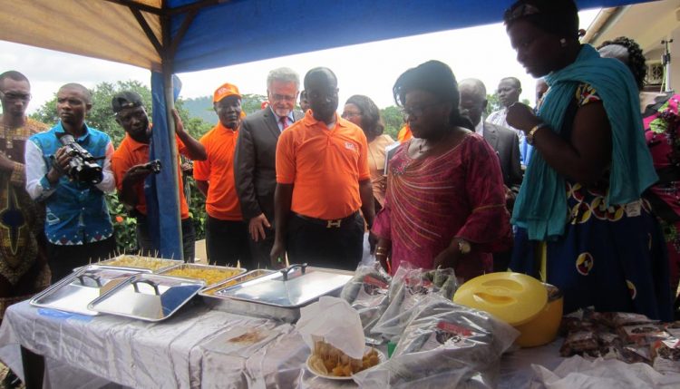 Picture of Ananga Messina, who represented the Minister of Agriculture and Rural Development, at the event tasting some finshed and nutritious food products from IITA staple crops.