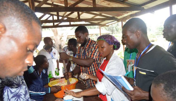 Picture of Ms Jacinta Ezurike showing participants how to make various value-added products.