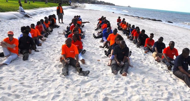 Picture of scientists bonding through fun activities on the beach.