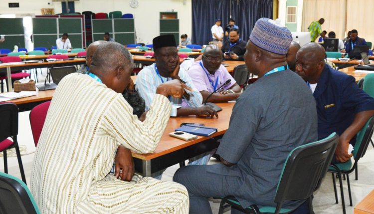 Picture of Maize seed health workshop participants in a discussion.