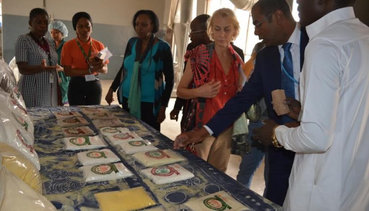 Picture of World Food Programme representatives taking a look at some cassava products in IITA.