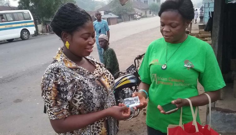 Picture of two women discussing ACAI ID card