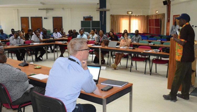 Picture of Tonny Omwansa, IITA Director, Research Support services, discussing and enlightening the participants.