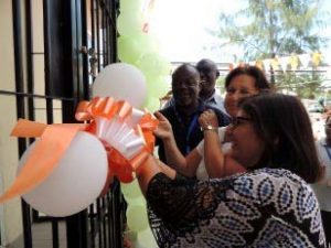 Picture of Leena Tripathi cutting the ribbon to officially commission the new FMS building in Dar es Salaam