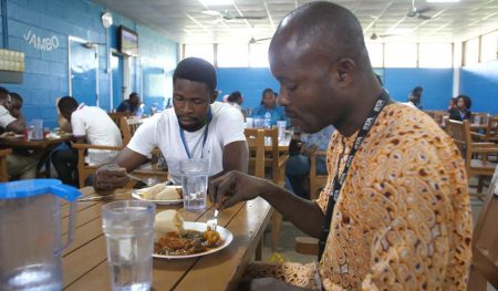 Picture of staff members enjoying their lunch at the IITA staff canteen