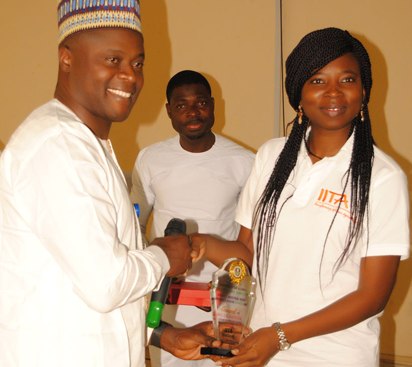Sore receives award of recognition presented to IITA by the University.