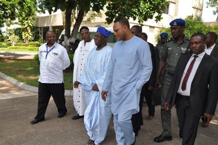 Picture of IITA DG Nteranya Sanginga (left) and former Nigerian President Olasegun Obasanjo (wearing blue headdress) with some government officials and partners.