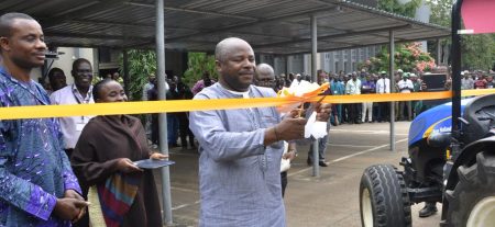 Picture of DG Sanginga cutting the tape to launch the equipment