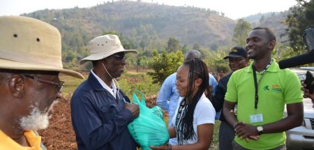 Picture of IKYA members giving some agroprocessing products to (L-R) the South-Kivu Governor HE Marcelin Chishambo Ruhoya and General Secretary Adolphe Mulumba.