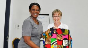 Picture of Ylva receiving a goodbye gift from Eveline Odiambo.