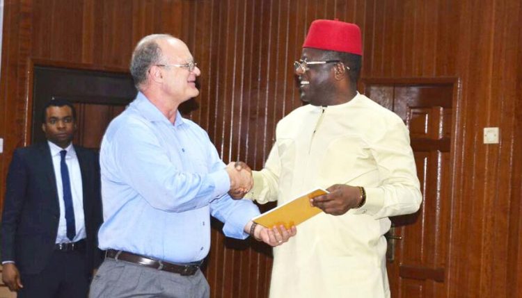 Picture of Kenton Dashiell, IITA DDG, Partnerships for Delivery (left), presents the implementation document of the Forum to His Excellency, Engr. Dave Umahi, the executive Governor of Ebonyi state.