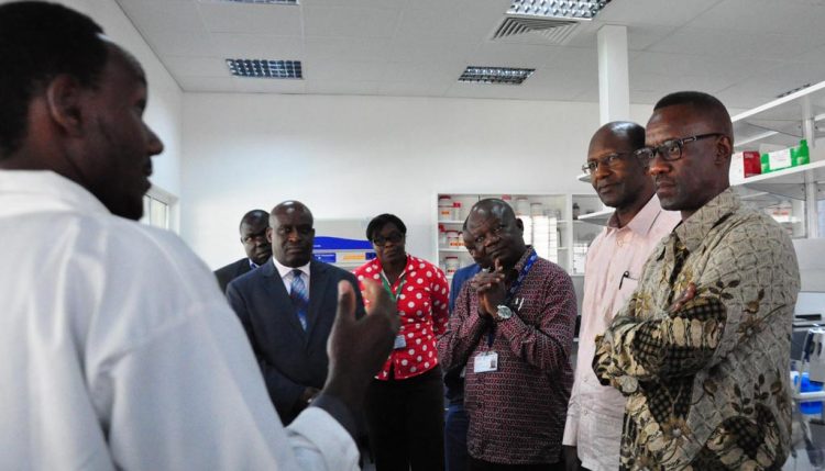Picture of the team from Foreign Affairs Officials accompanied by staff at the hub on a tour of the laboratories.