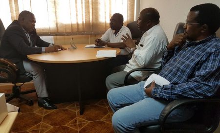 Picture of DG Sanginga meeting with DPA Dzucula (extreme left) while Chikoye and Boahen look on.