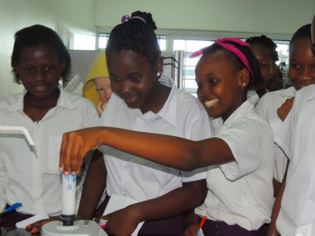 Picture of students getting an opportunity to use scientific equipment in the labs.