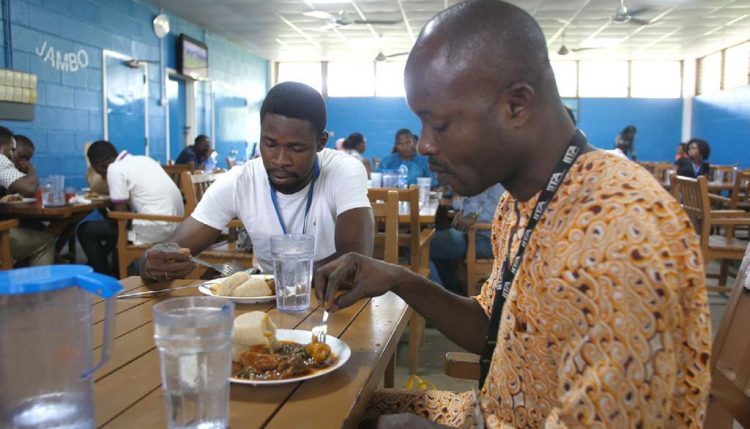 Picture of staff members enjoying their lunch at the IITA staff canteen